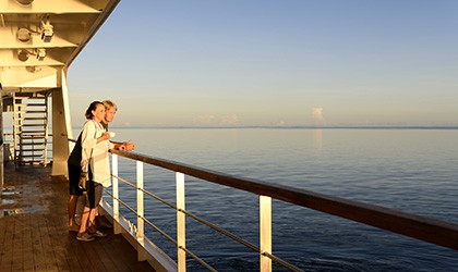 A couple enjoying time at sea from the Xplorer Deck